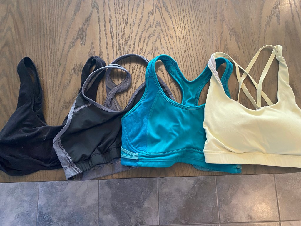 four sports bras on a table
